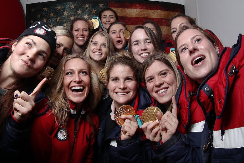 GANGNEUNG, SOUTH KOREA - United States snowboard gold medalist Jamie Anderson poses for a selfie with some members of the United States women's hockey team and their gold medals on the Today Show Set on February 22, 2018 in Gangneung, South Korea.